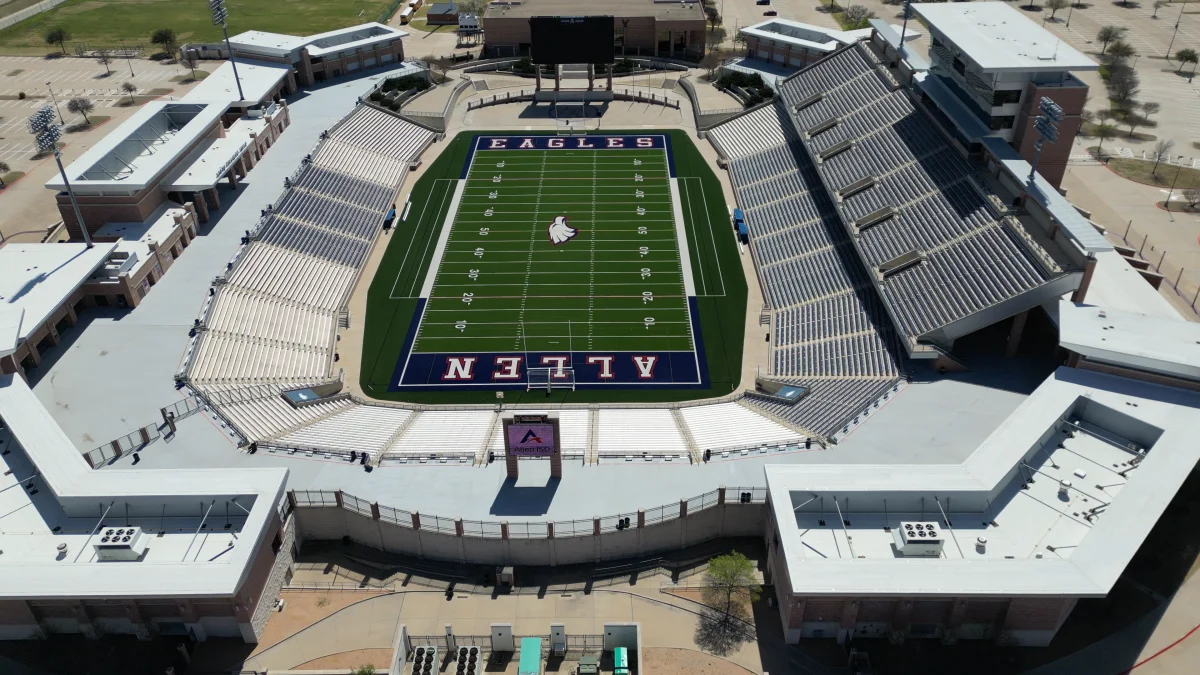Aerial view of an Allen ISD stadium and surrounding campus buildings